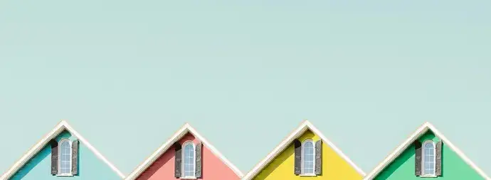 Side-by-side comparison of homes with dark and light colored roofs showing energy efficiency differences