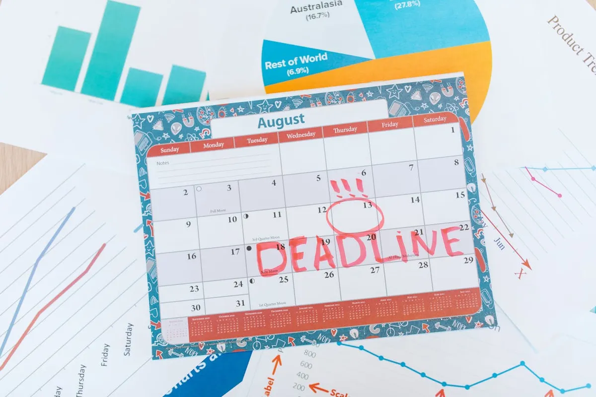Calendar page with marked deadline date next to homeowner insurance policy documents
