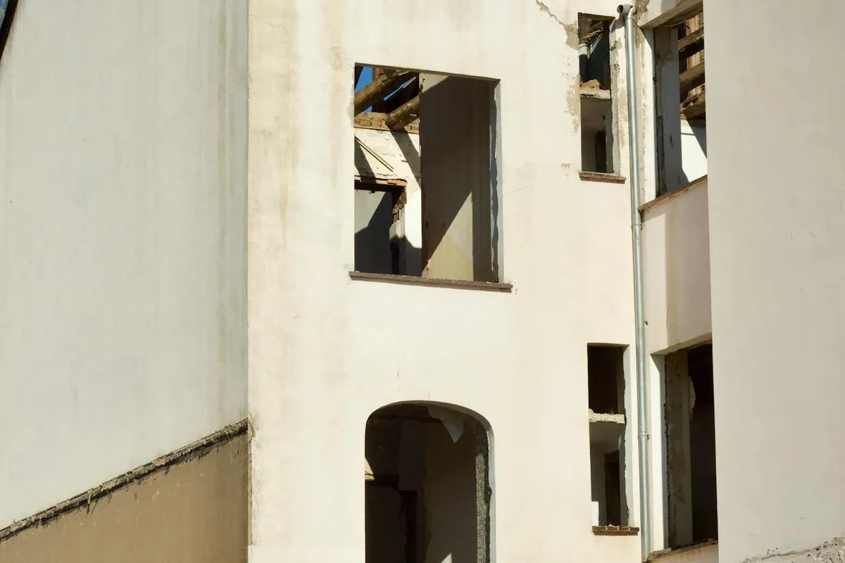 Split view comparing a roof section being repaired versus a full roof replacement in progress